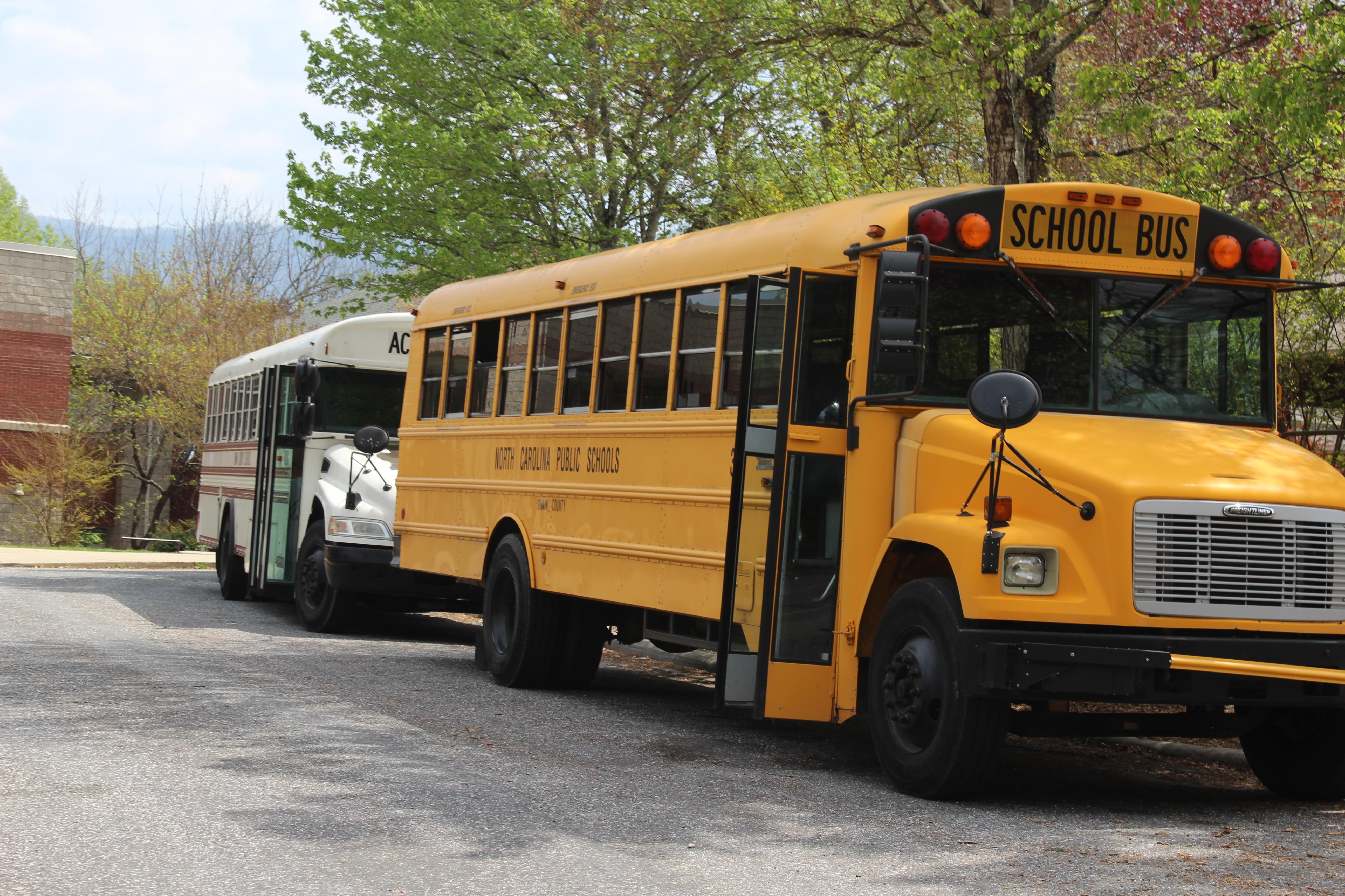 School buses are parked at Swain Middle School ready to transport students home on Tuesday. The school board just approved funding to upgrade the bus cameras.