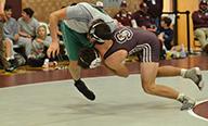 Maroon Devil Thomas Allen knocks his opponent off his feet at the Devil Duals held at Swain County High School on Saturday.