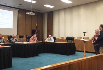 Swain HD Director Alison Cochran and Schools Superintendent Mark Sale speak to commissioners Thursday night.
