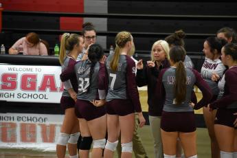 Coach McMahan talks to her volleyball team