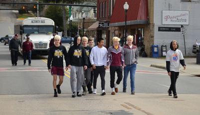 The Swain County Maroon Devils wrestling team had a victory walk through town after returning from the state championships.
