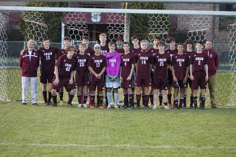 Swain boys soccer team is pictured as a group after winning conference