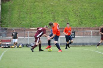 Adam Cotterman battles it out for the ball in the Invest game