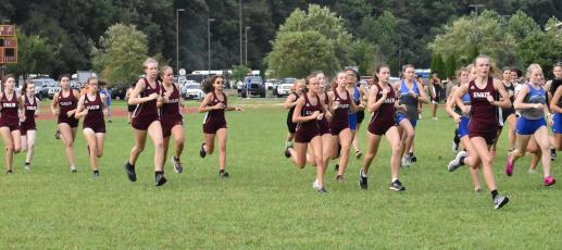 Lady Maroon Devils take off at the starting line at the recent meet held at Cherokee. 