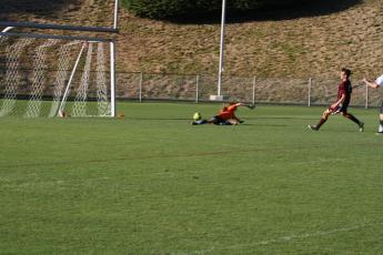 Maroon Devil Matthew Gray shooting just past the goalie for a Devil’s score in the win over Asheville Trailblazers. 