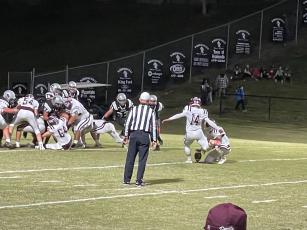 Maroon Devil Gavin Lanning kicks a good point after a Devils touchdown in the 31-14 away loss to Robbinsville on Tuesday night. The team will host Cherokee on Friday. 