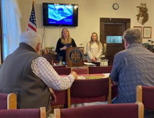 Charley Rice Thompson, BRH communications manager, and Miranda Massingale, clinical support staff at Swain, presenting before Rotary Club. 