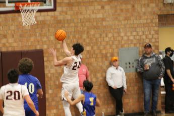 Nathan Bogdanowicz goes up for a layup against Highlands