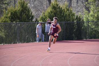 Josiah Glaspie running in the team relay at Cherokee last week. He came in 6th in the 300 meter hurdles out of 25 runners and 9th in the 100 meter dash out of 50.