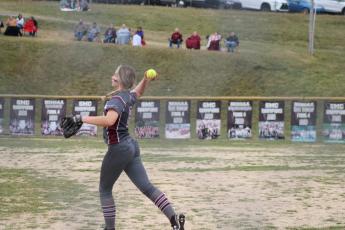 Junior Tori Johnson throws the ball to first base from outfield
