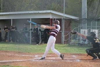 Sophomore Brayden Ruis swings at the 4-0 shutout game against the Yellow Jackets last Thursday.