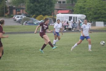 Karena Cline passes to Helpman for another goal by the pair during the game