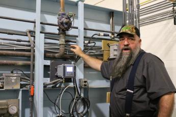 Russell Ball, supervisor and operator in responsible charge at Town of Bryson City water plant, goes over the details of how the plant processes water. 