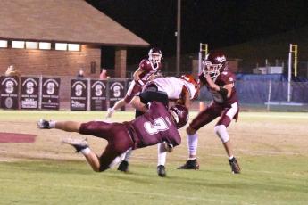 Photo by Joanna McMahan Swain Maroon Devil Josh Collins takes down a Phoenix player with Reece Winchester ready to back him up at the first playoff win last Friday.