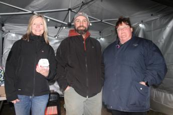 From left, Cindi Woodard, Cabbott Cochran and Missy Sutton volunteer at the Christmas Spectacular to benefit local nonprofits including Swain Cancer Support.