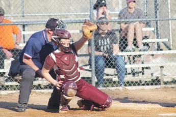 Carley Teesateskie catches a pitch as the Lady Devils played the Rosman Tigers on Tuesday, Feb. 28.