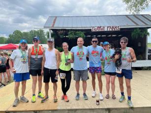 Several members of the BCOutdoors Run Club at last year’s Strawberry Jam half marathon at Darnell Farms. They are planning to do it again this year, according to club founder Kelli Walsh (pictured second from right).
