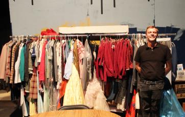 Ricky Sanford, president of the Community Theatre Association, looks at some of the costumes still needing to be assessed to see if they’ll ever be usable again after flooding damage a couple of years ago.