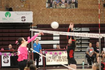 Lady Devil Gracie Sutton spikes the ball at the game against Andrews on Thursday, Oct. 12, which the Devils won 3-0.