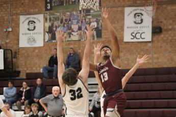 Maroon Devil senior Josiah Glaspie makes a jump at the game against North Buncombe on Thursday, Dec. 28.