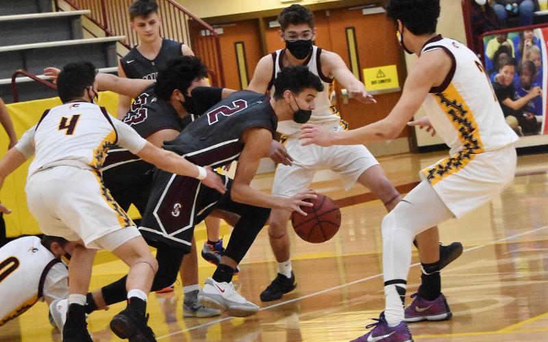 The away game against Cherokee on Friday was a physical game. Pictured, Maroon Devils Judaiah Littlejohn (2) and Carson Taylor (23) fend off Braves players for control of the ball.