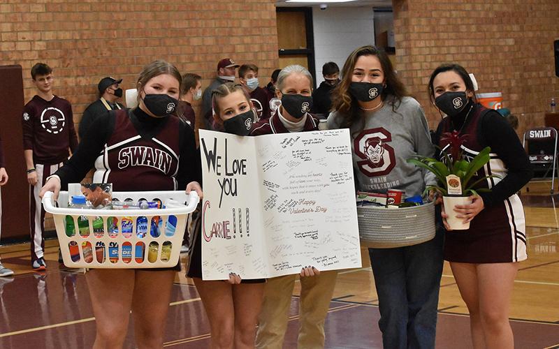 Lady Devils Cheerleaders Tsini McCoy and Isabella Garcia organized the surprise thank you to athletic trainer Carrie Powell that included a huge Valentine’s card with signatures, a basket of goodies and a house plant. The gifts were presented at halftime last Thursday. 