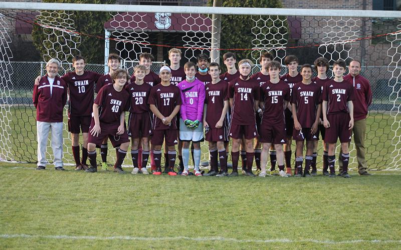 Swain boys soccer team is pictured as a group after winning conference