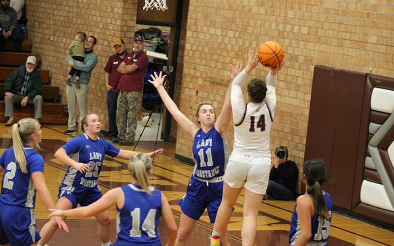 Senior Savana Smith goes up for a basket against the Mustangs