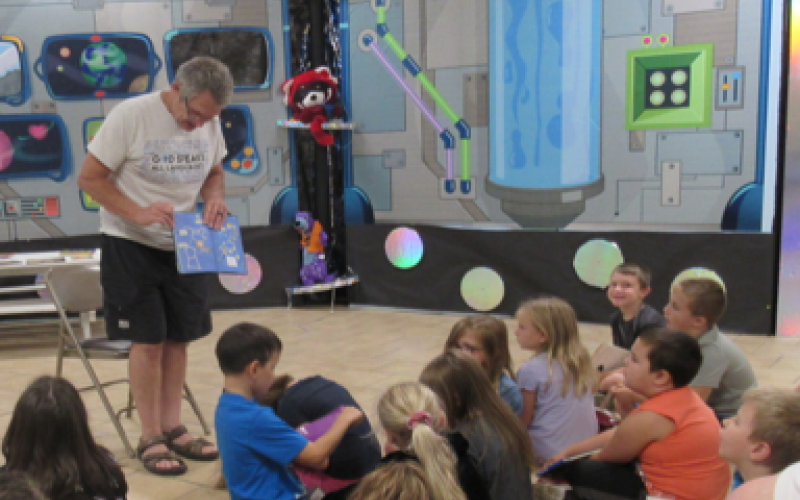 Wayne Dickert reads to students during the 2019 summer reading camp. The theme was “Reading Is Out of This World.”