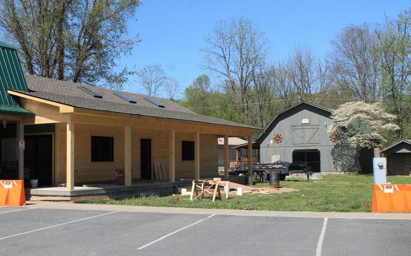 The Fly Fishing Museum of the Southern Appalachians is moving to its new location on Island Street to open next month. The new building, pictured above, is modeled after a log cabin and was built by county workers.