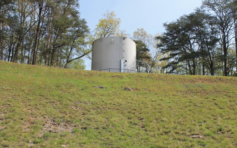 The high school water tower is located up the bank from the football field.