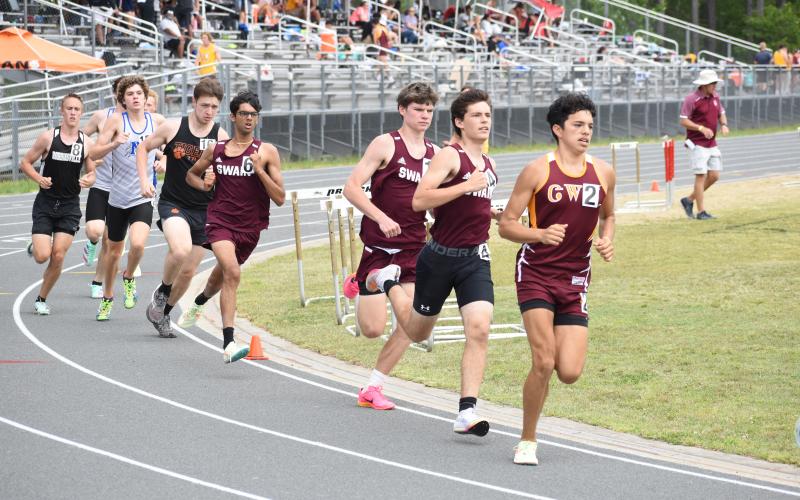 Runners make their way around the track at the regional competition held Friday. From the front (right) are: Jaylan McCoy-Bark (Cherokee), Kane Jones (Swain), Connor Brown (Swain), and Abhi Patel (Swain). The Maroon Devils came away as regional champions.