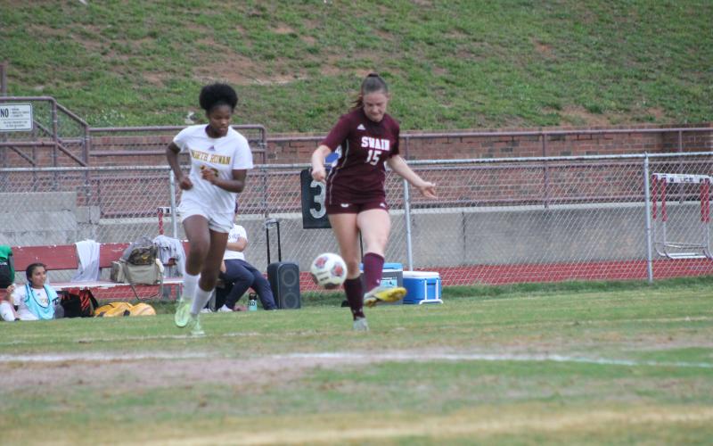 Lady Devil Karena Cline battles for the ball at Monday’s playoff game.