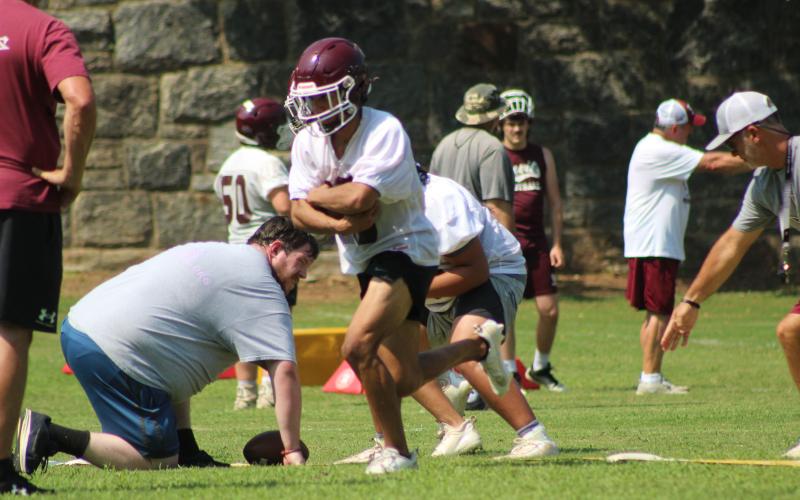 Swain football athletes conduct drills on the first week of practice