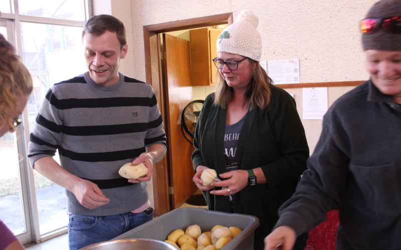 New The Giving Spoon executive director Ricky Sanford (left) and board member Misty Lynne Sneed help peel potatoes that will be served to the community, as per the nonprofit’s mission.