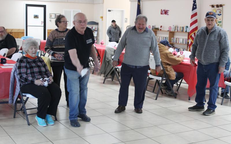 From left, Pam Dengler, Margaret McCarty, John Crisp, Bruce Billstein and Harold Parton play a rousing game of a variety of cornhole as part of the weekly group activities class held Monday mornings at the Swain County Center and led by Shannon Royce of TOA Bryson City