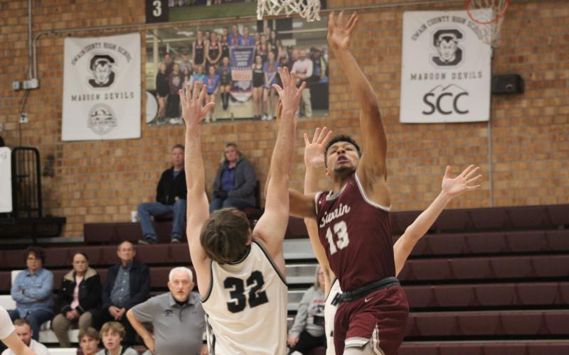 Maroon Devil senior Josiah Glaspie makes a jump at the game against North Buncombe on Thursday, Dec. 28.