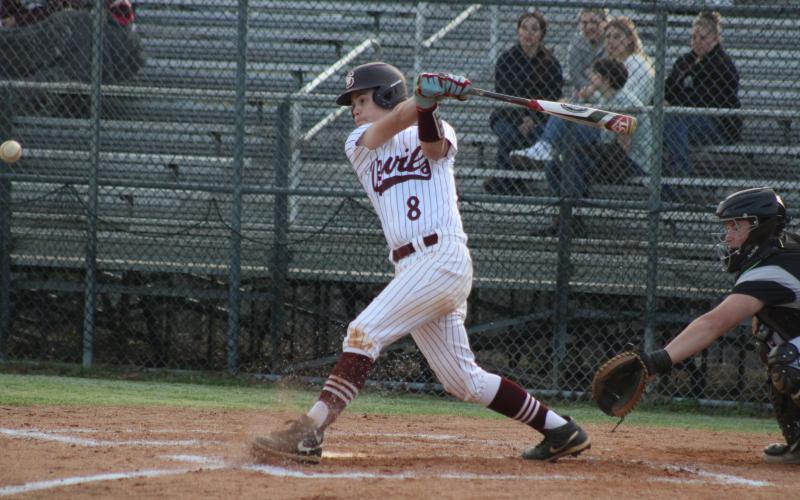 Senior Lawson Woodard swings at the game against the Black Knights – while the Devils lost that game 10-8, they’d also beaten the Cherokee Braves 19-0 earlier on Monday, March 25.
